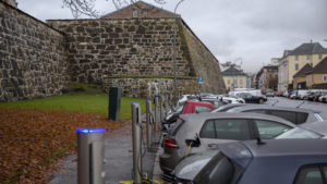 Electric vehicles (EV) sit parked at charging stations at Kongens gate near Akershus festning in Oslo, Norway, on Monday, Nov. 21, 2016. The International Energy Agency forecasts that global gasoline consumption has all but peaked as more efficient cars and the advent of electric vehicles from new players such as Tesla Motors Inc. halt demand growth in the next 25 years. Photographer: Fredrik Bjerknes/Bloomberg via Getty Images